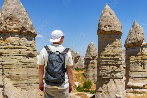 Canvastavla Traveler exploring Love valley rock formations in Cappadocia with backpack