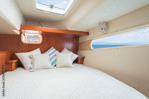 Photos Sleeping bedroom/berth on charter and private sailing catamaran with white and b