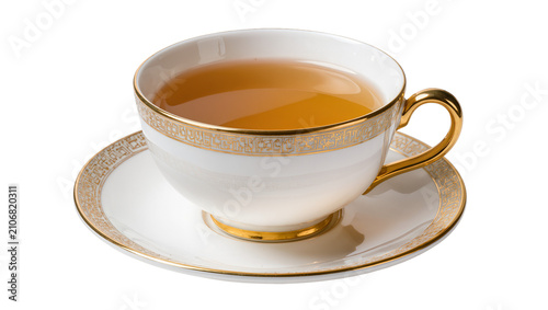 Foto Isolated elegant white porcelain teacup and saucer filled with amber tea, luxuri