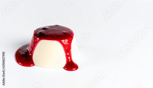 Creamy Vanilla Panna Cotta Dessert Topped with Sweet Red Berry Coulis Isolated on a Minimalist White Background