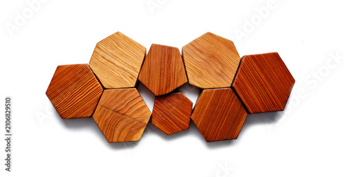 Wooden hexagons on a white background. Geometric figure hexagon decor element. Isolated.