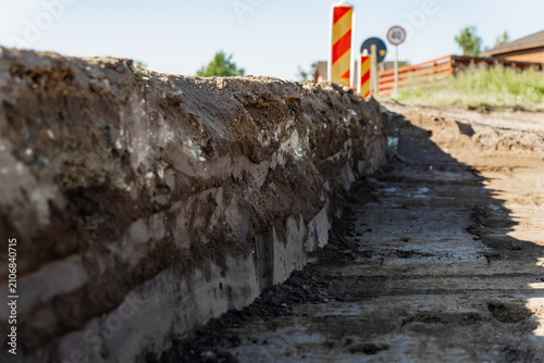 Fotografija Layered soil cross section and excavated ground levels on a roadbed development