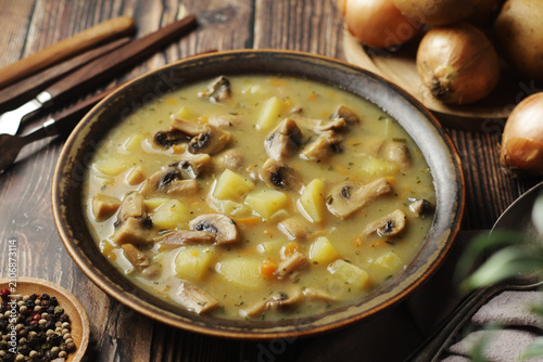 A bowl with traditional Czech mushroom Bramborcka soup
