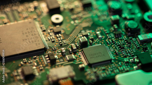 Obraz na plátne Green circuit board displaying microchips and electronic components