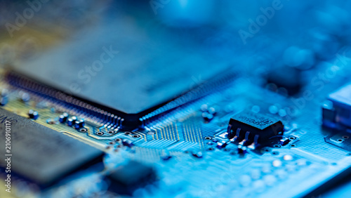 Foto Circuit board with microchip technology representing digital data