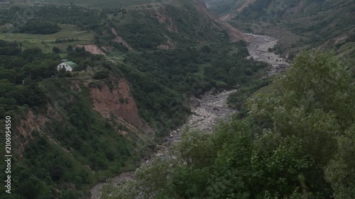 A mountain landscape with a beautiful mountain stream and a forest