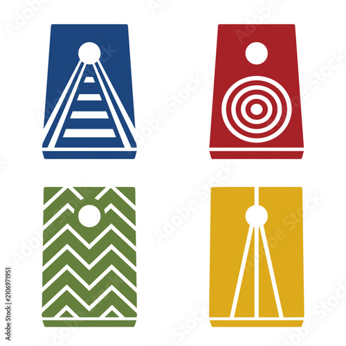 Cornhole boards set with colorful geometric patterns and target holes