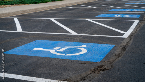 handicapped parking signs on a large lot