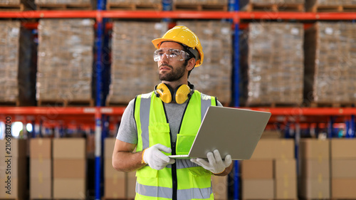 Factory workers, engineer in warehouse, International import export , logistic business concept. Logistics, transportation, distribution concept. Team of factory workers working in logistic warehouse.