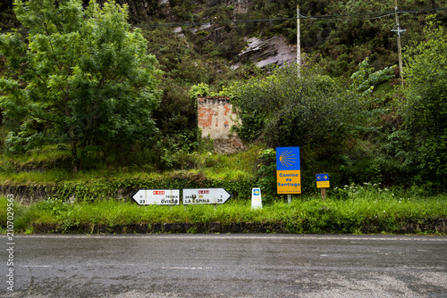 Traditional pilgrim milestone and traffic indicators in Asturias, Spain