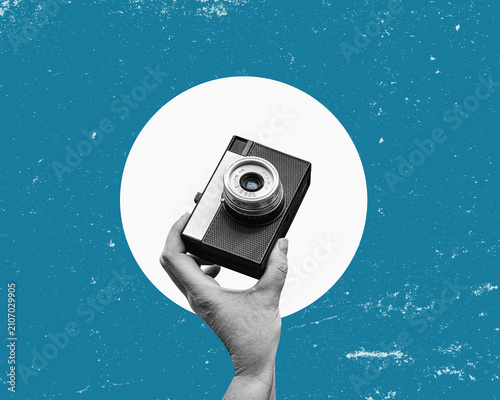 A hand holding retro analog camera. Vintage photo poster. Flat design art collage.