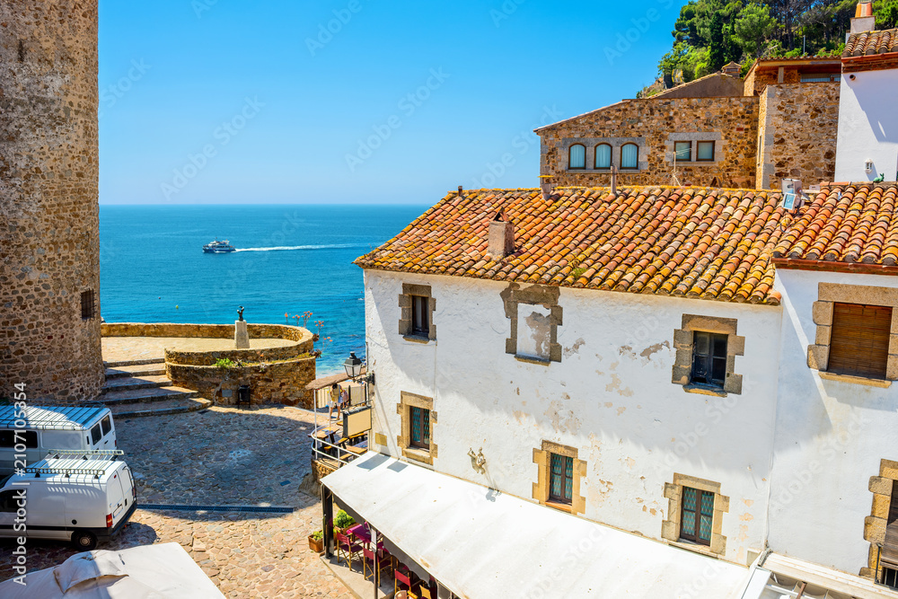Obraz premium View of historical houses at old district near beach in Tossa de Mar. Costa Brava, Catalonia, Spain