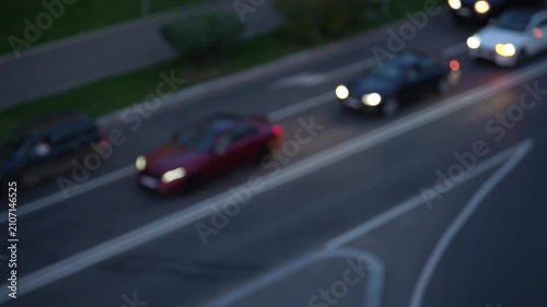Blurred cars starting movement after traffic light on urban road, dynamic city traffic scene showing transportation, mobility and motion concept