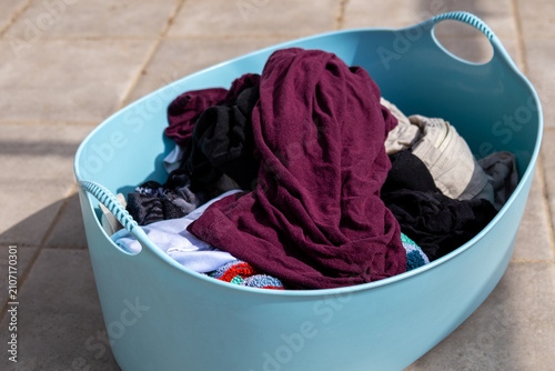 Quadro su tela lue laundry basket filled with dirty clothes ready for washing on tiled floor