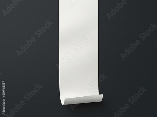 Long white paper roll hanging on a dark gray wall