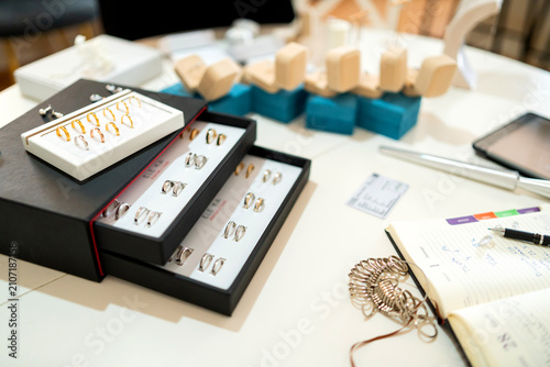 Jewelry collection displaying artisan wedding rings and custom size sizer tools