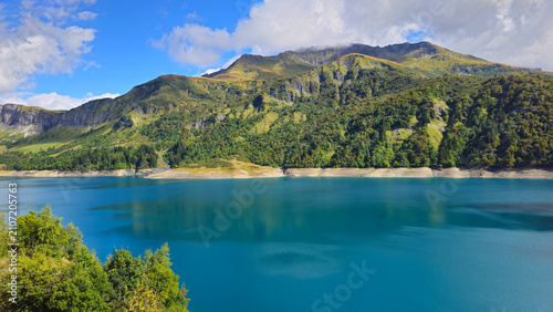 Bild auf Leinwand Lake Lac de Roselend in the mountains landscape, French Alps, Beaufort, Savoie, France, Europe