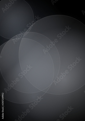Minimalist black bokeh background with soft grey circles, elegant dark abstract light texture, moody monochromatic blurred lens flare effect