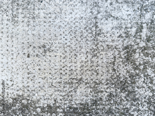 фотографія Light grey speckled concrete texture background, mottled rough cement surface pa