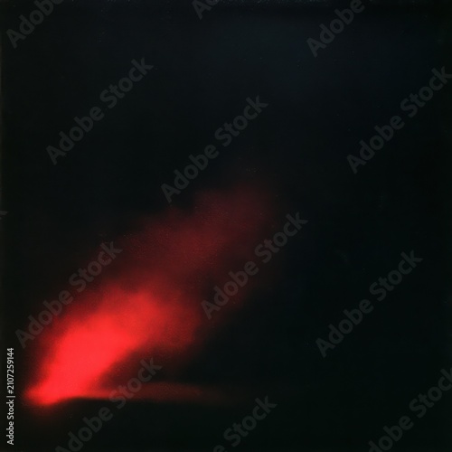 Abstract dark background with a glowing red light flare or beam emerging from the corner, creating a mysterious and intense atmospheric effect