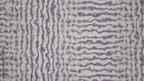 An abstract purple and white wavy texture creates a seamless looping background pattern.