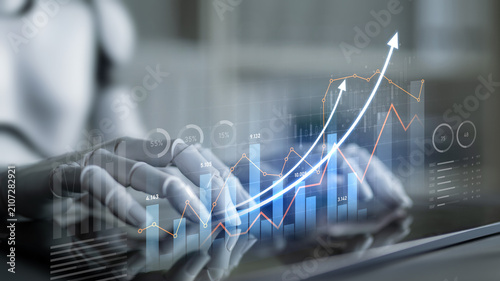 Fotografía A business analyst engages with advanced technology, interpreting data trends through graphs and charts, highlighting growth and success in financial markets
