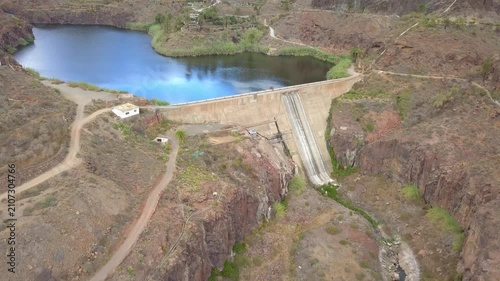 Ayagaures reservoir in a rocky canyon landscape showing low water levels. Global warming and climate change impact on water resources