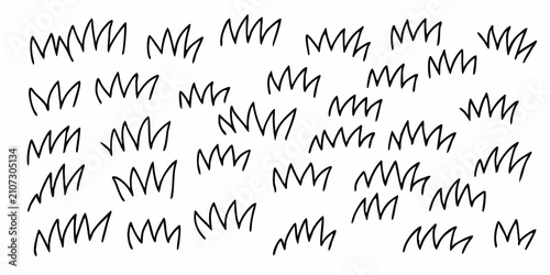 фотографія Hand drawn ink grass tufts pattern on a white background organic and textured