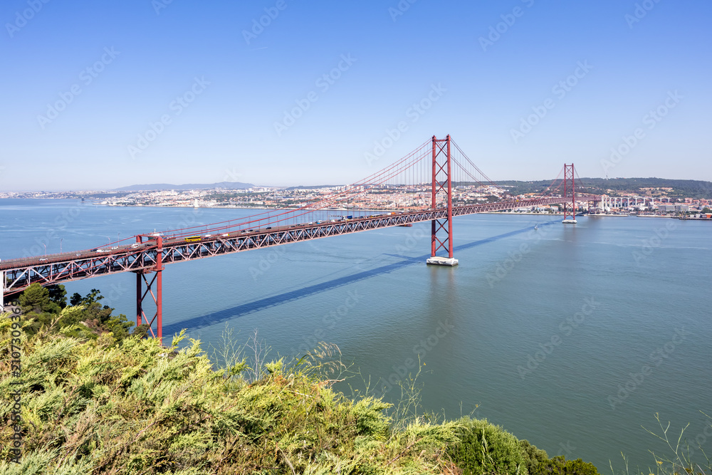 Fototapeta premium Ponte 25 de Abril suspension bridge over Tagus River in Lisbon, Portugal