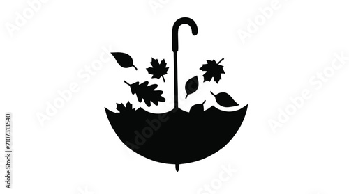 Black silhouette of an umbrella catching falling autumn leaves