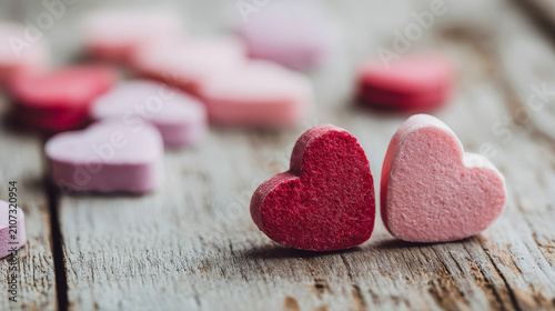 Colorful heart candies on a wooden table during a celebration or gathering
