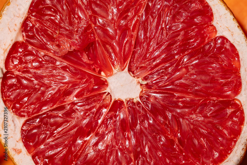 Red grapefruit pulp texture fresh juicy close up