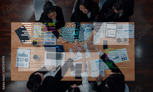 Obraz na płótnie A diverse business team engages in a productive meeting, leveraging artificial intelligence to drive strategy with data visualization tools for enhanced decision-making and collaboration