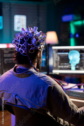 Obraz na plátně IT admin controlling computer functions using mind helped by headset