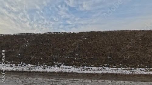 Along the road, winter roadside view, view from the car window. Snow winter day.	