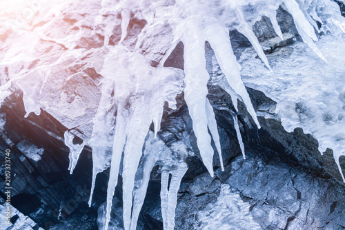 Hanging Icicles on Rocky Cliff Surface in Winter — Ice Cave Detail