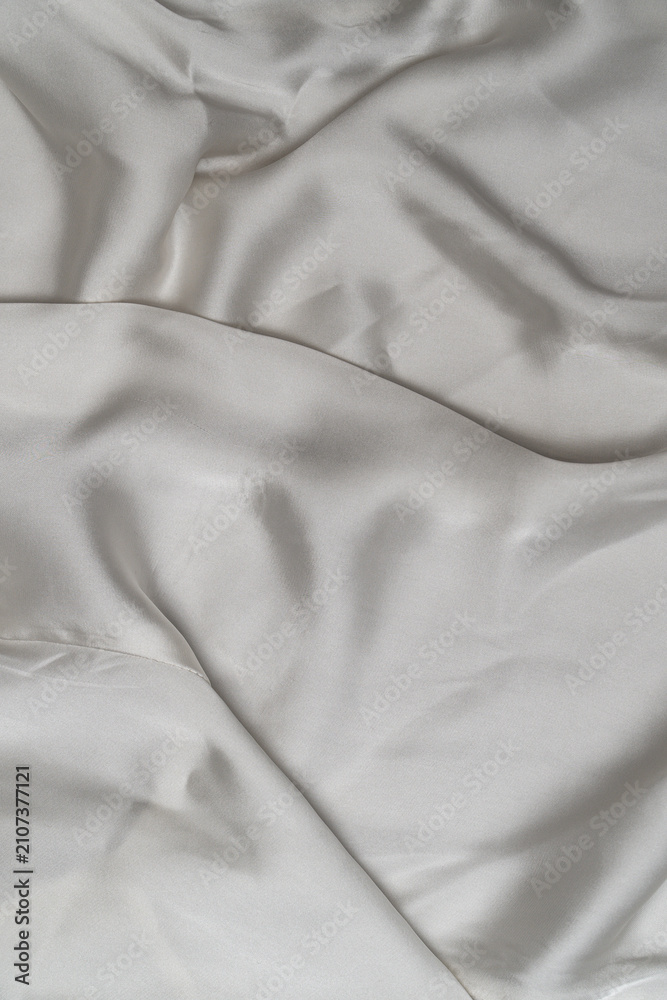 Fototapeta premium Elegant white satin cloth with folds