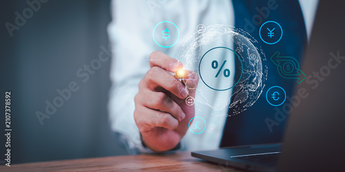 Obraz na plátne Financial analyst monitors foreign exchange rates, global currency markets, interest rate trends, cross-border payments, fintech solutions, digital banking, and international financial transactions