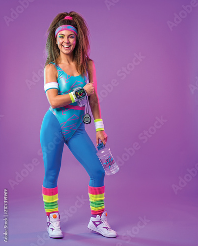 Retro 80s Fitness Woman in Blue Leotard and Leg Warmers