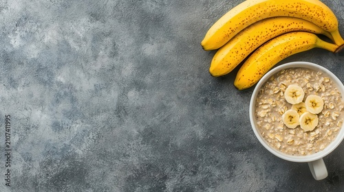 Flat lay of healthy breakfast routine with overnight oats, bananas, and coffee