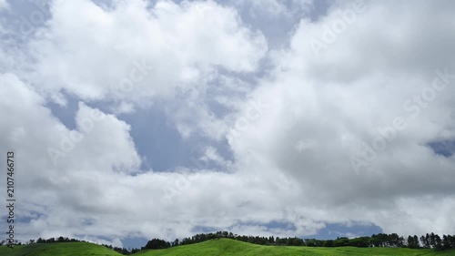 Timelapse footage of white clouds over green mountain plateau, Izu Peninsula