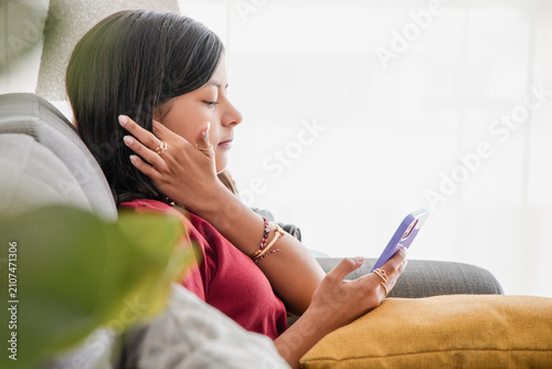 Teenage Girl Relaxing While Listening to Phone Call