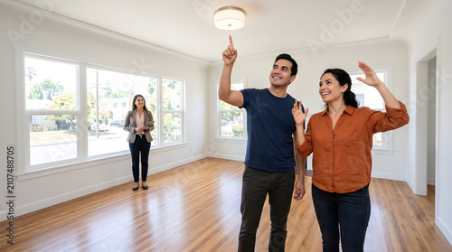 Couple viewing new home with real estate agent