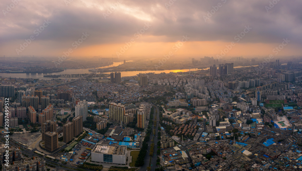 Obraz premium Aerial View of Cityscape and Pearl River Delta at Golden Sunset