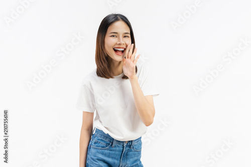 Happy Asian business woman shouting and hands over mouth on white color background.