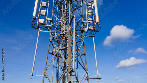 Canvas Print Aerial view of telecommunications tower with several radio masts and antennas ag