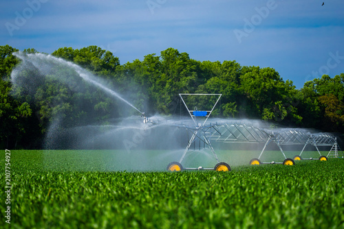 Obraz na płótnie Irrigation system crosses rural field