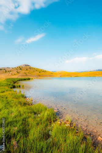 Deep blue waters of Vrazje Jezero (Devil's Lake) on the high plateau of Durmitor National Park, scenic mountain lake landscape in Montenegro.