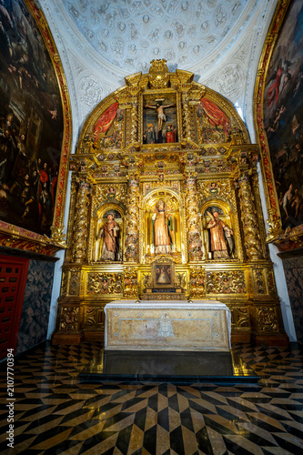 Photography Vertical view of the gilded baroque altarpiece inside the Chapel of Saint Valerius featuring San Valero and side paintings at La Seo Cathedral in Zaragoza