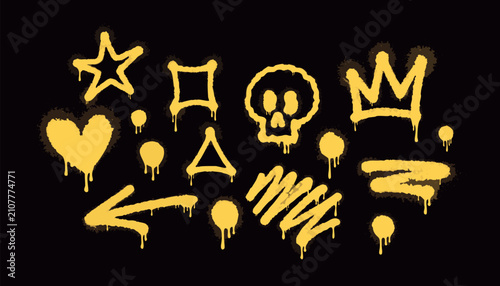 Yellow spray paint graffiti icons set, street art doodles with crown, skull, heart, and arrow isolated on black background